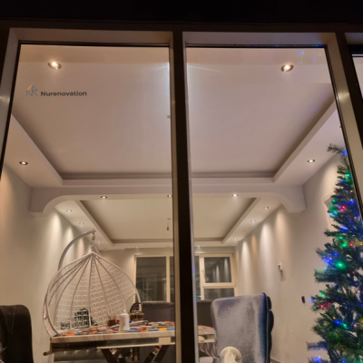 Outside vies of a living room with a custom made ceiling and fresh walls | Nurenovation